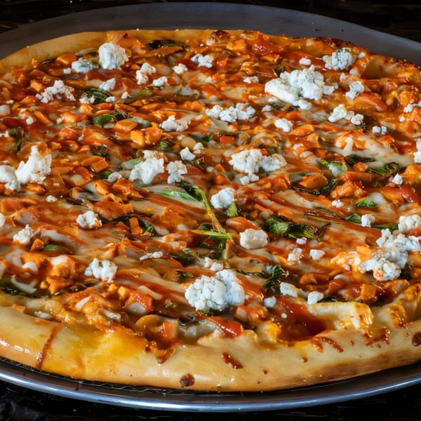 A Task Force Pizza with buffalo chicken, mozzarella, blue cheese crumbles, and a drizzle of hot sauce.